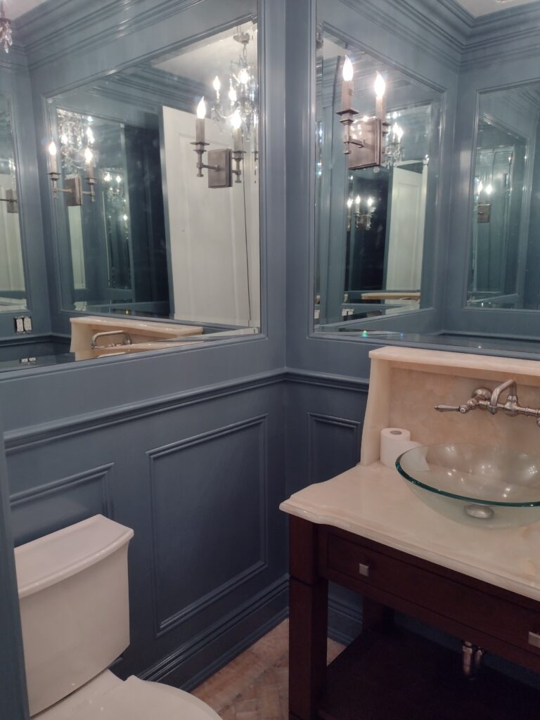 Custom blue bathroom woodwork and architectural trim professionally painted in Saddle River, NJ