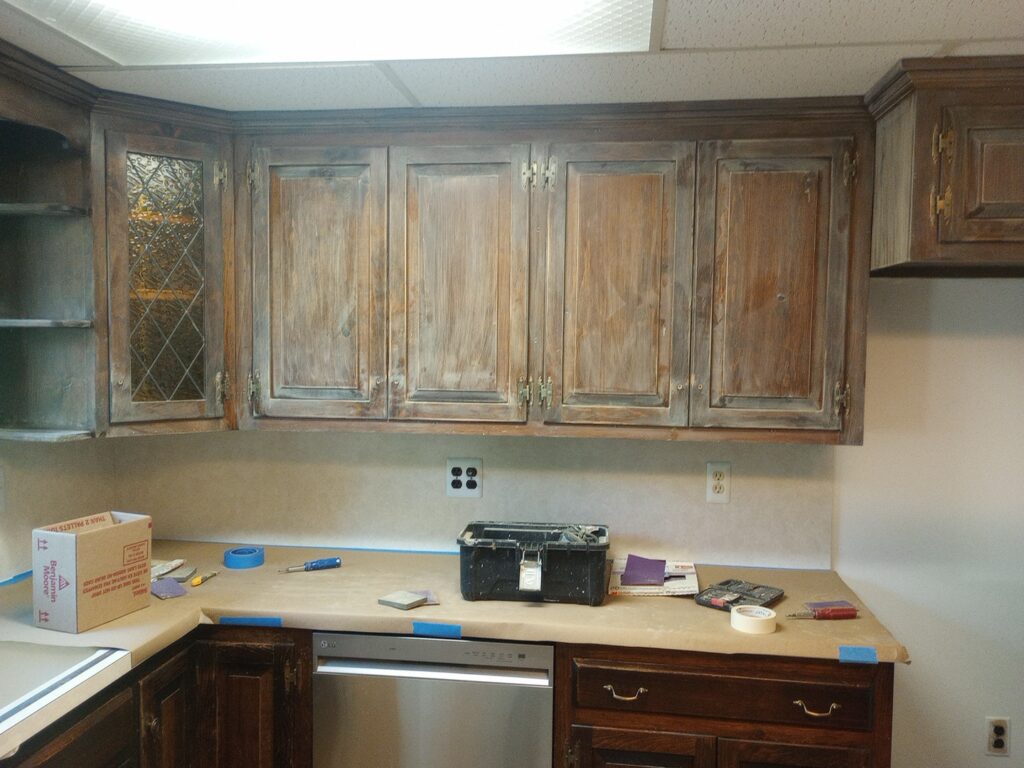 Kitchen cabinets being professionally prepared for painting in Midland Park, NJ